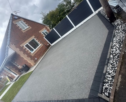 resin driveway completed in Steel Blue with block paving border